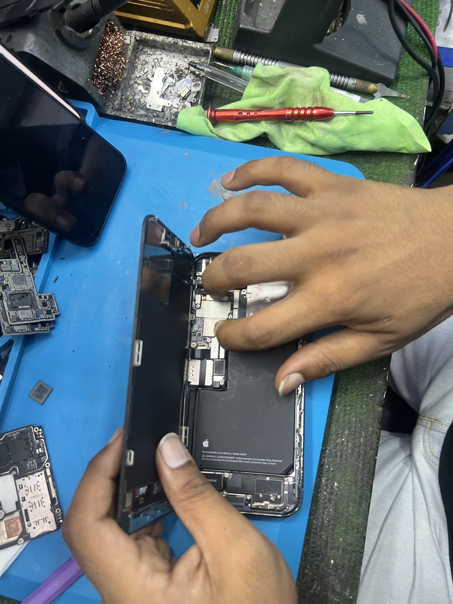 iPhone open-board repair at Ewan Trading Concern